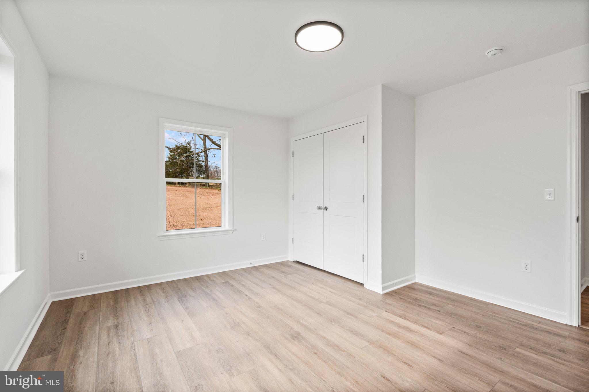 239 Brookview Drive Newport, PA 17074 - Photo 23 of 42 an empty room with wooden floor and windows
