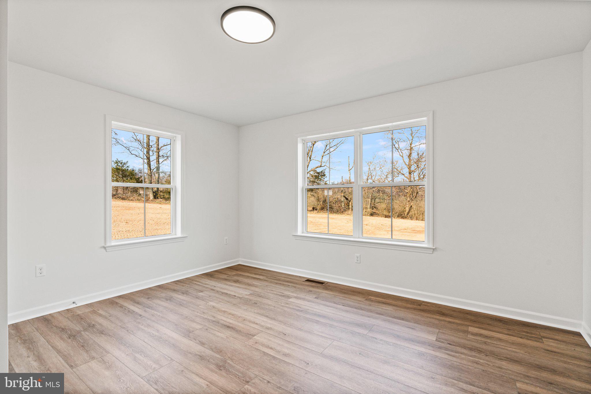239 Brookview Drive Newport, PA 17074 - Photo 24 of 42 an empty room with wooden floor and windows