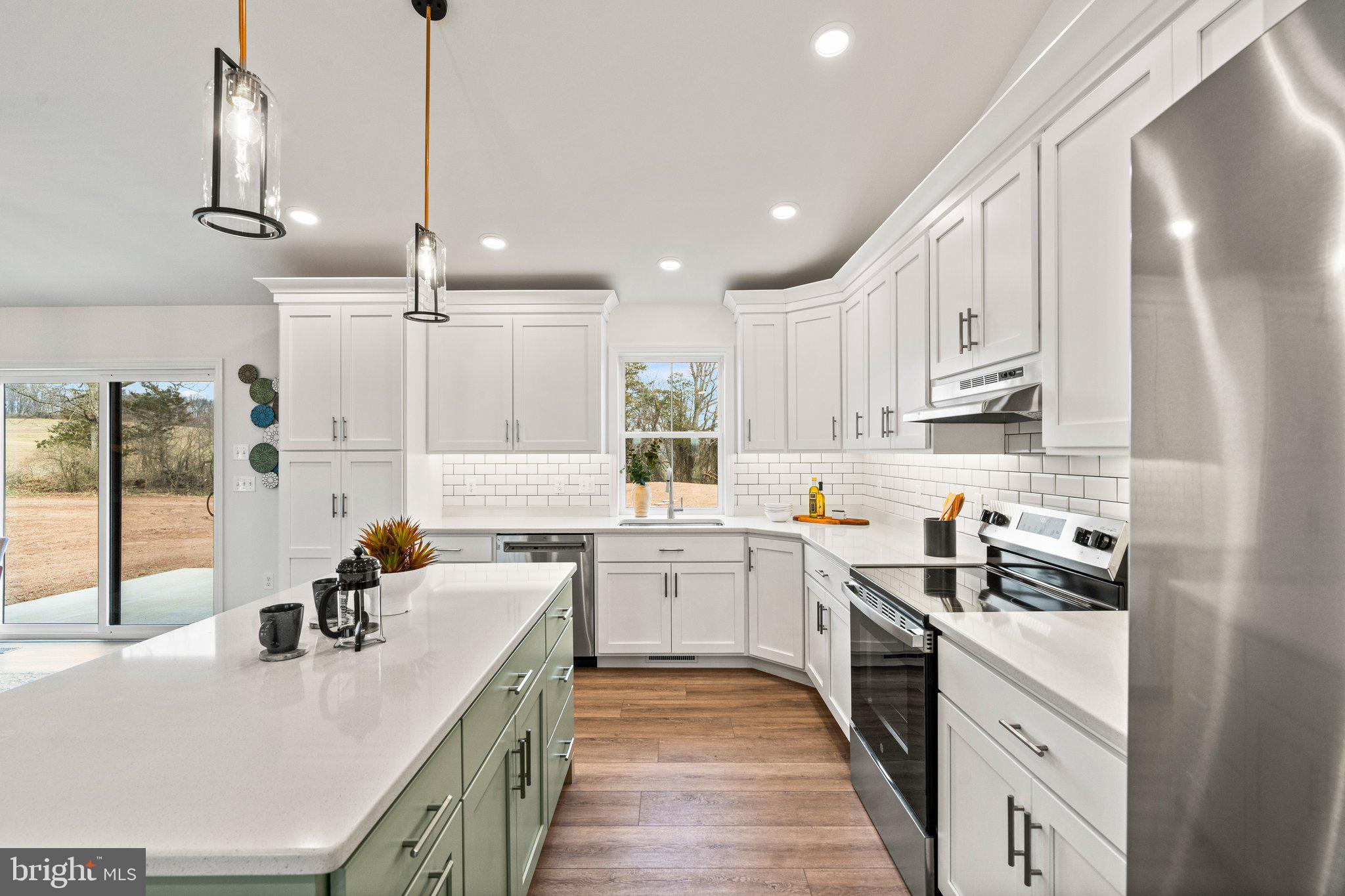 239 Brookview Drive Newport, PA 17074 - Photo 8 of 42 a kitchen with kitchen island granite countertop a sink a counter space appliances and cabinets