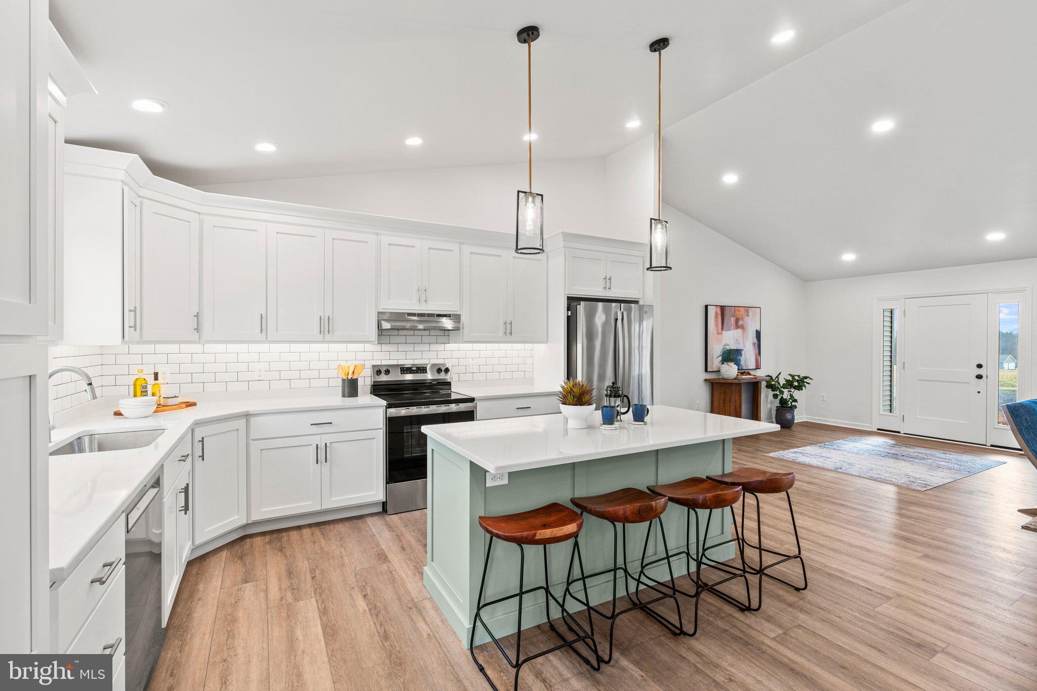 239 Brookview Drive Newport, PA 17074 - Photo 9 of 42 a kitchen with stainless steel appliances kitchen island granite countertop a stove a sink a dining table and chairs