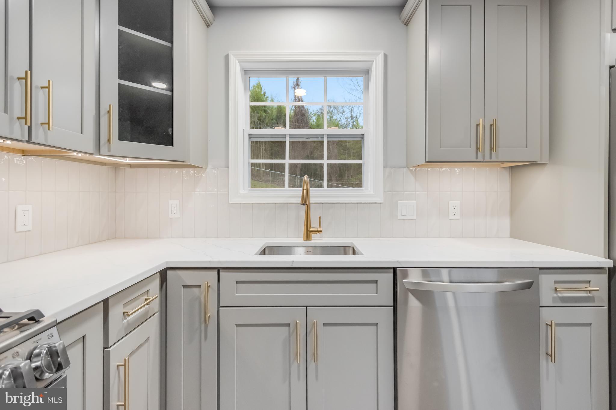 4010 Oaklawn Road Fort Washington, MD 20744 - Photo 12 of 37 a kitchen with a sink cabinets and window
