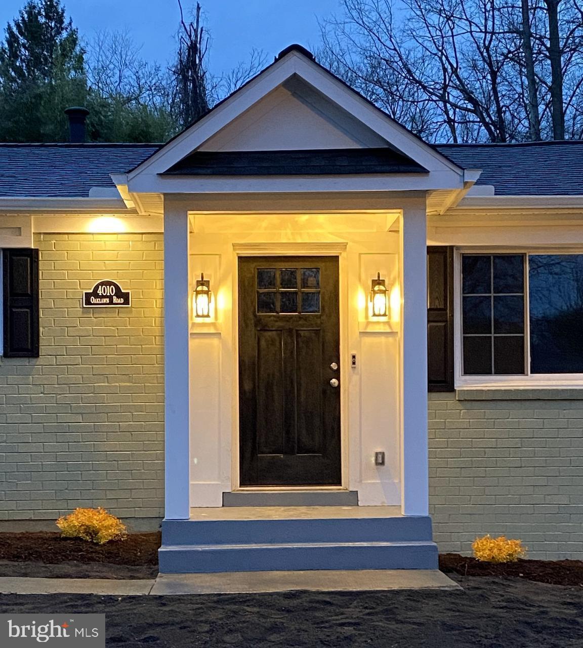 4010 Oaklawn Road Fort Washington, MD 20744 - Photo 2 of 37 a front view of a house with a yard