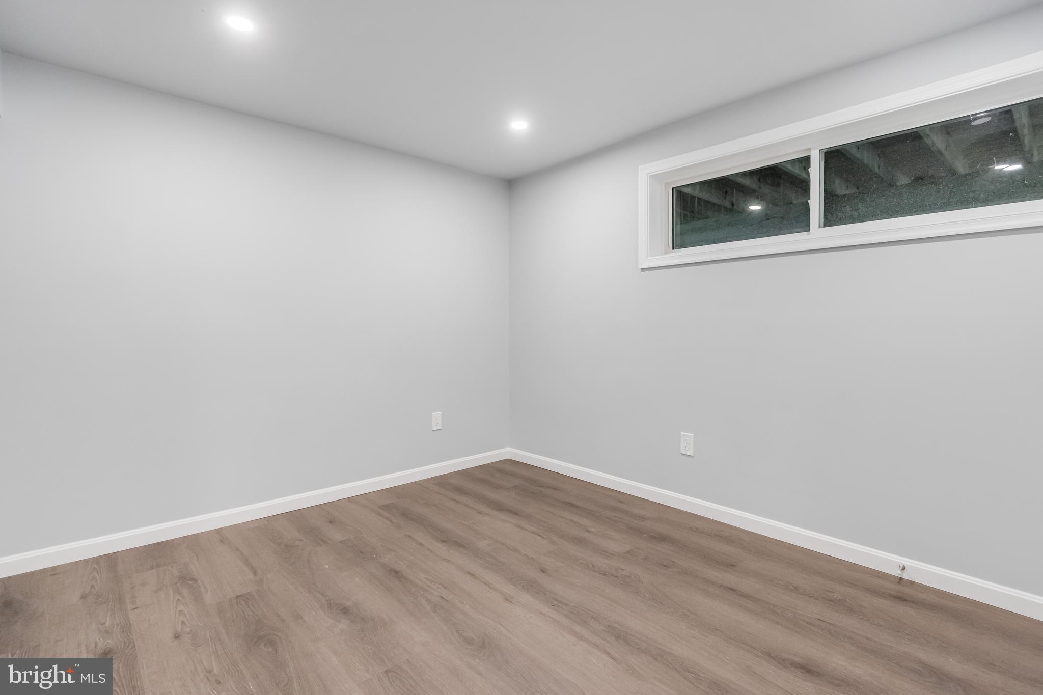 4010 Oaklawn Road Fort Washington, MD 20744 - Photo 24 of 37 a view of an empty room with wooden floor and a window
