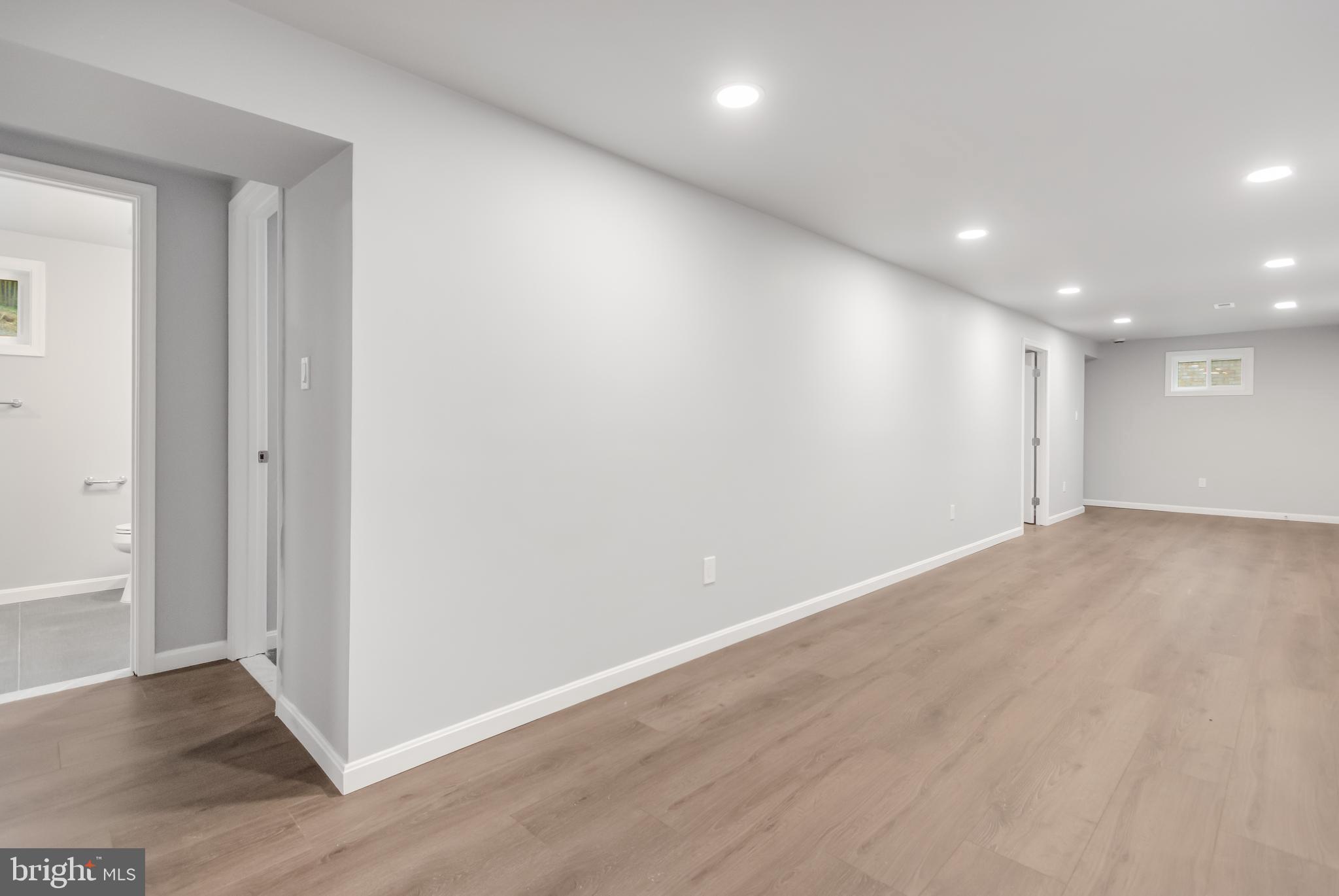 4010 Oaklawn Road Fort Washington, MD 20744 - Photo 34 of 37 an empty room with wooden floor and windows
