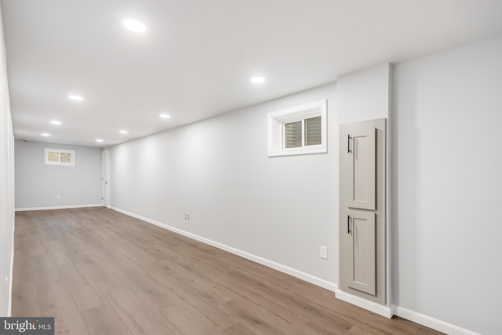 4010 Oaklawn Road Fort Washington, MD 20744 - Photo 35 of 37 an empty room with wooden floor and windows