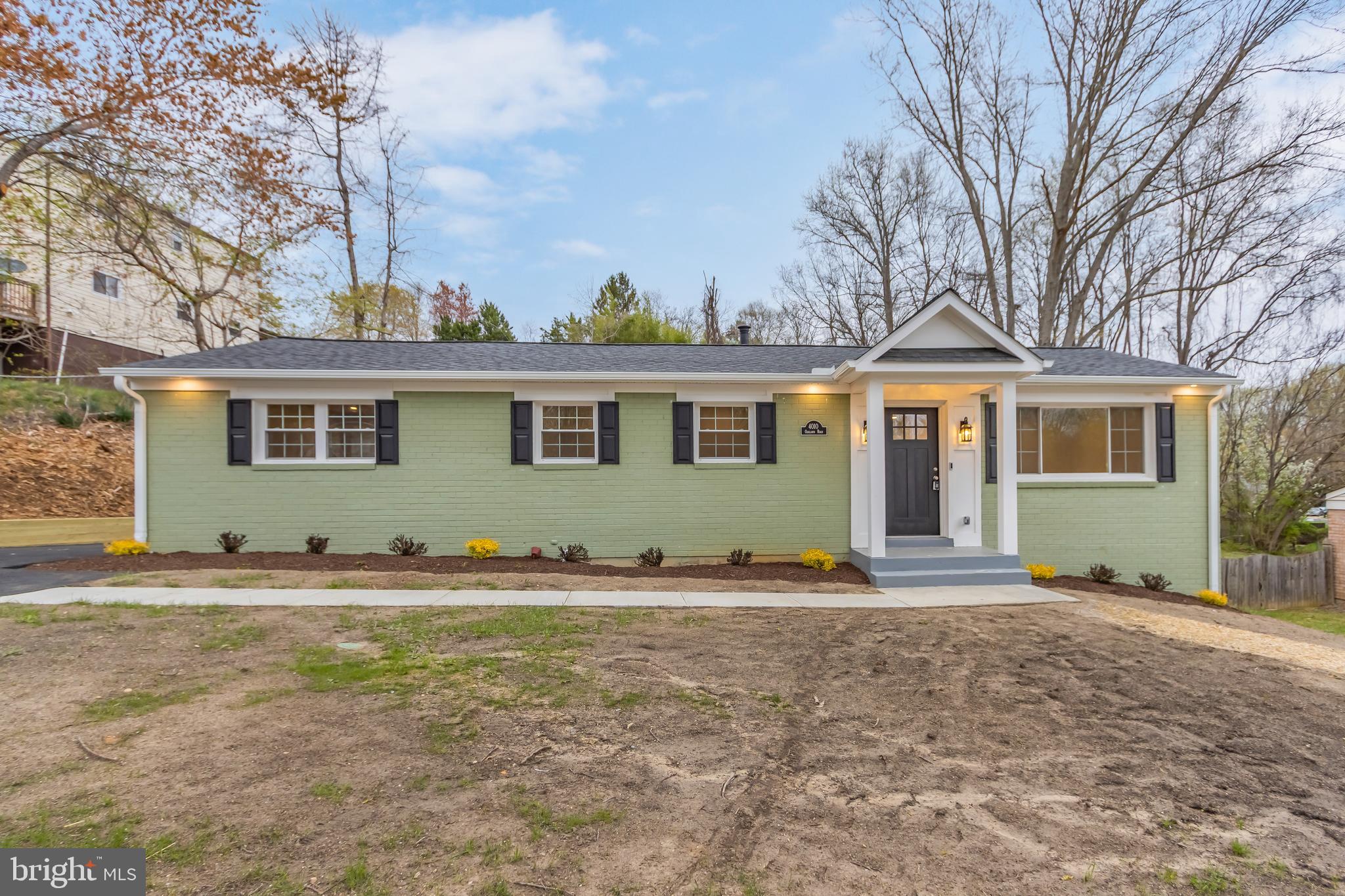 4010 Oaklawn Road Fort Washington, MD 20744 - Photo 5 of 37 a front view of a house with a yard