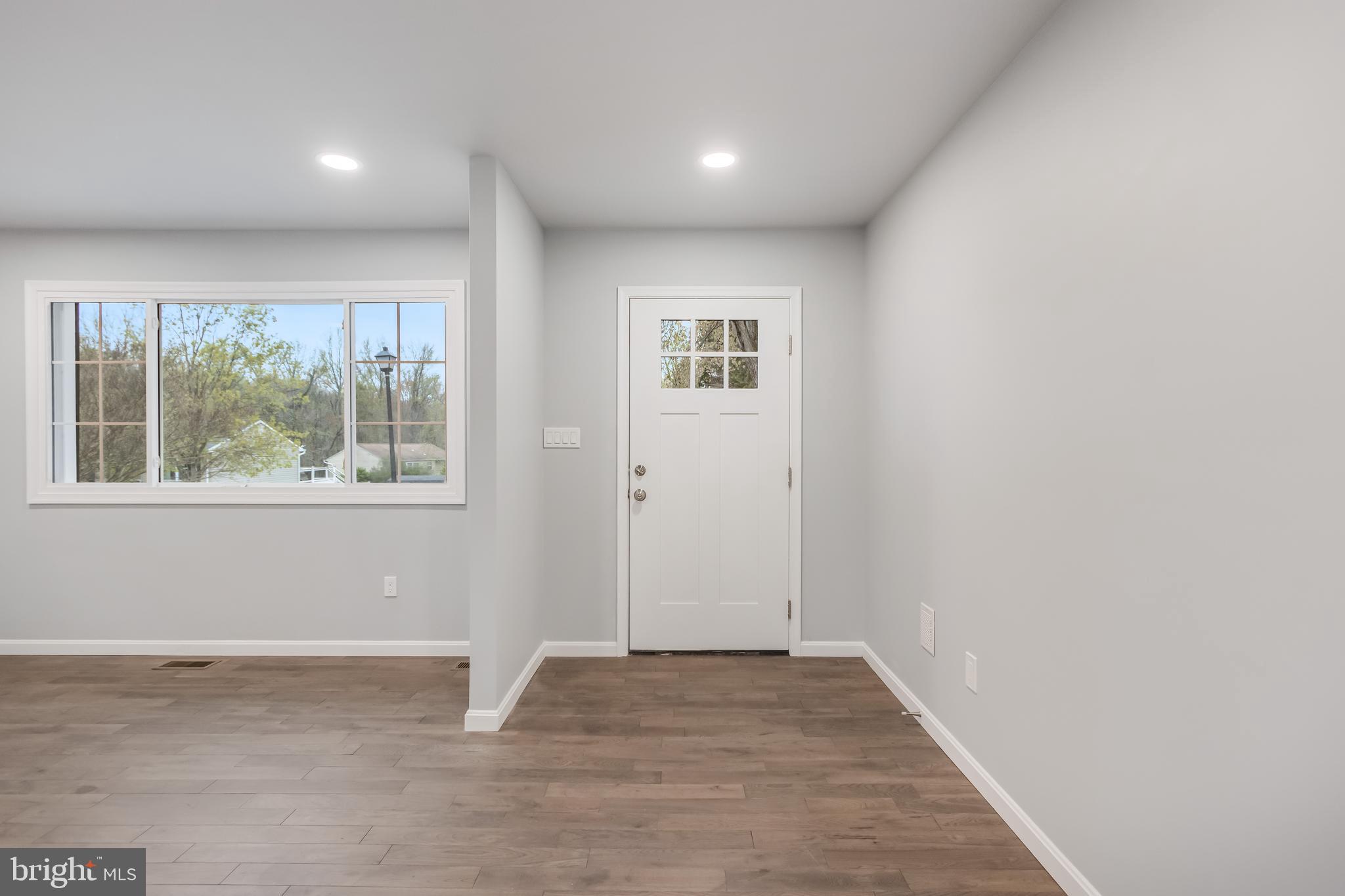 4010 Oaklawn Road Fort Washington, MD 20744 - Photo 7 of 37 an empty room with wooden floor and windows