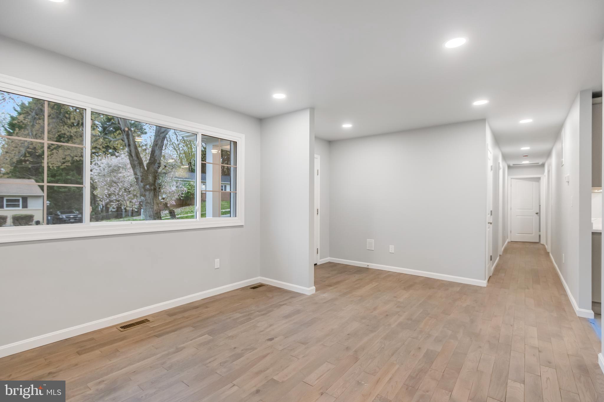 4010 Oaklawn Road Fort Washington, MD 20744 - Photo 8 of 37 a view of an empty room with wooden floor and a window