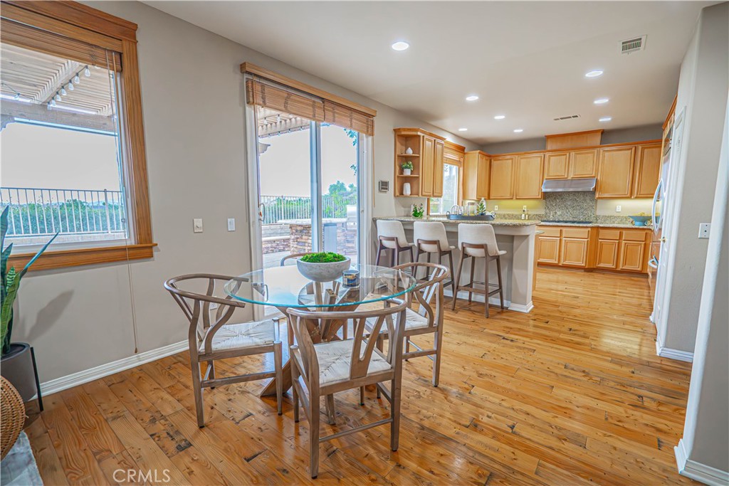 28419 Hidden Hills Drive Saugus, CA 91390 - Photo 12 of 60 a view of a dining room with furniture window and wooden floor
