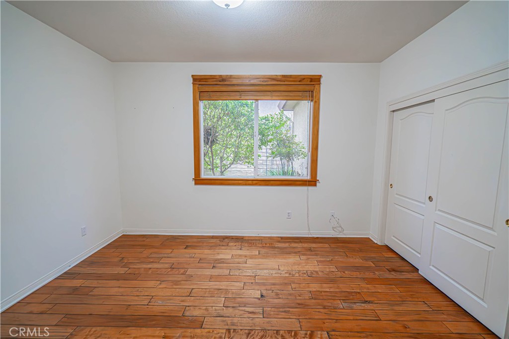 28419 Hidden Hills Drive Saugus, CA 91390 - Photo 22 of 60 a view of empty room with wooden floor and fan