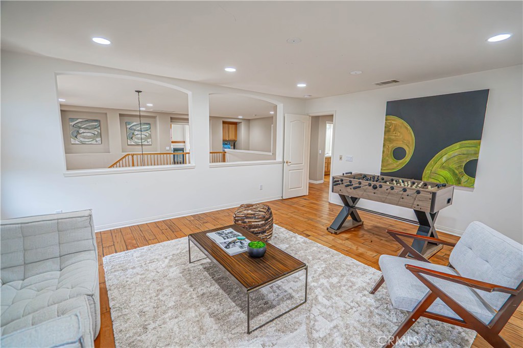 28419 Hidden Hills Drive Saugus, CA 91390 - Photo 30 of 60 a living room with furniture and a rug