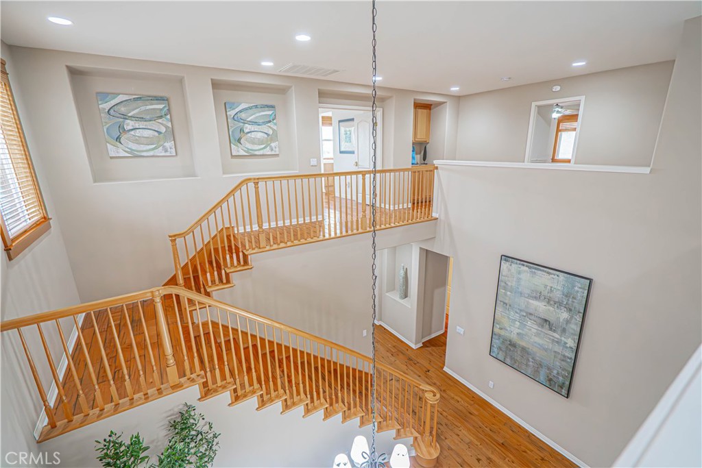 28419 Hidden Hills Drive Saugus, CA 91390 - Photo 31 of 60 a view of staircase with wooden floor and window