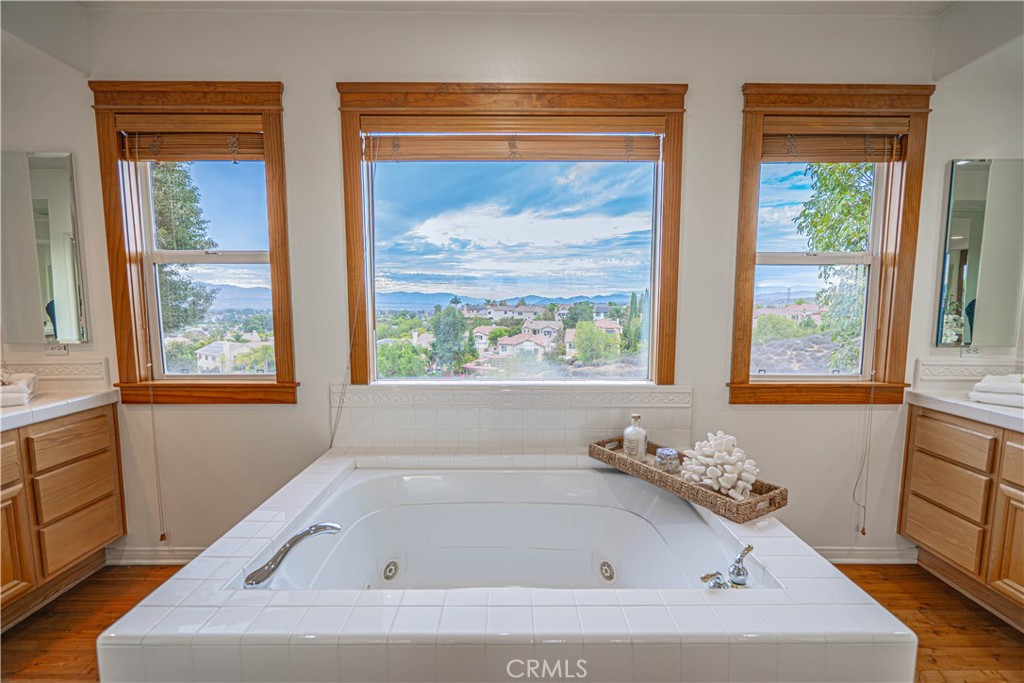 28419 Hidden Hills Drive Saugus, CA 91390 - Photo 39 of 60 a white bath tub sitting in a bathroom next to a window