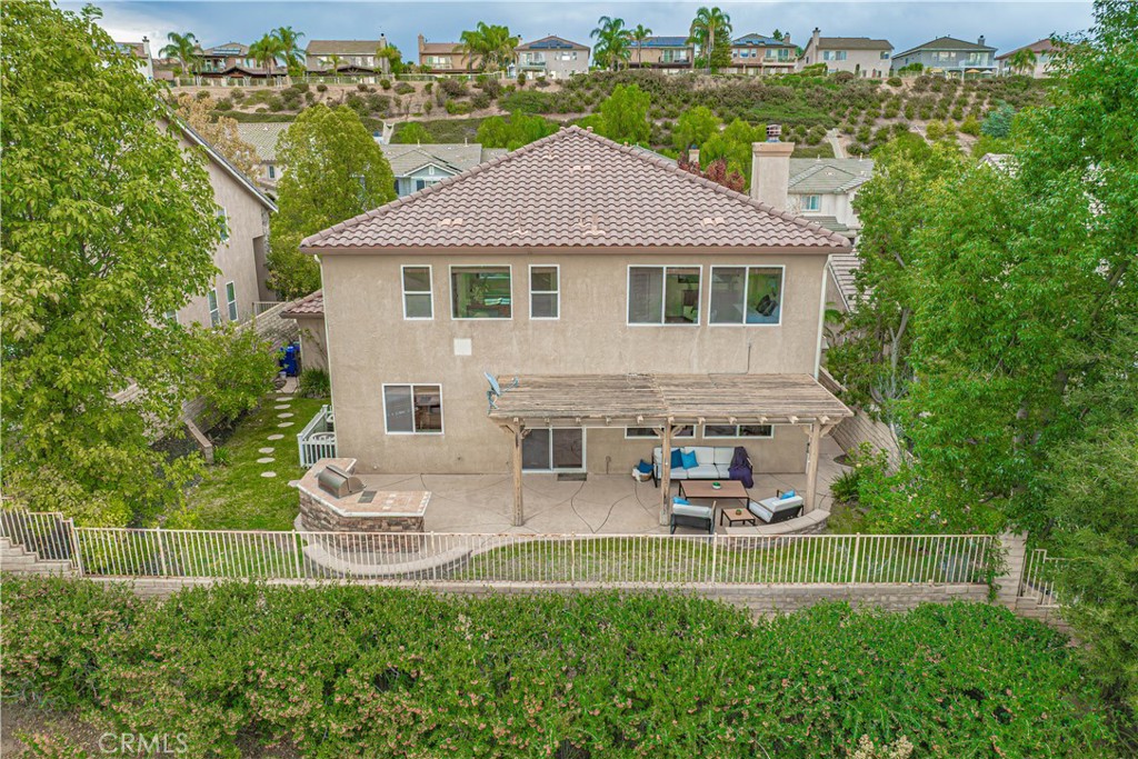 28419 Hidden Hills Drive Saugus, CA 91390 - Photo 58 of 60 a aerial view of a house with a yard table and chairs