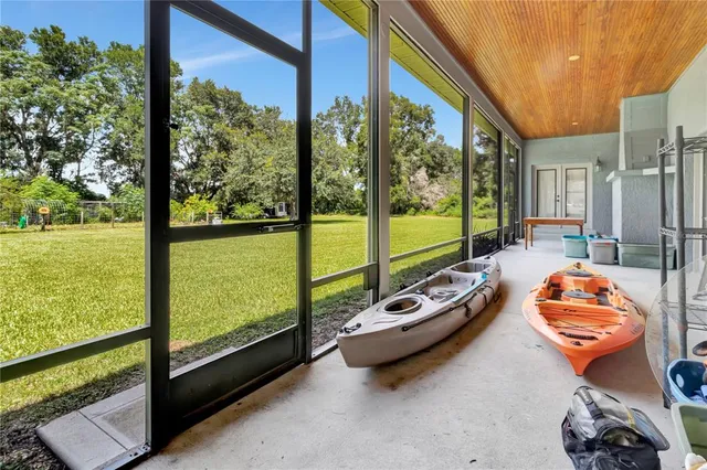a view of swimming pool with a table and chairs