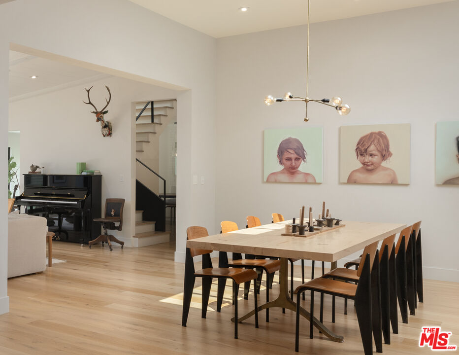 226 South Rimpau Boulevard Los Angeles, CA 90004 - Photo 12 of 43 a dining room with furniture and wooden floor