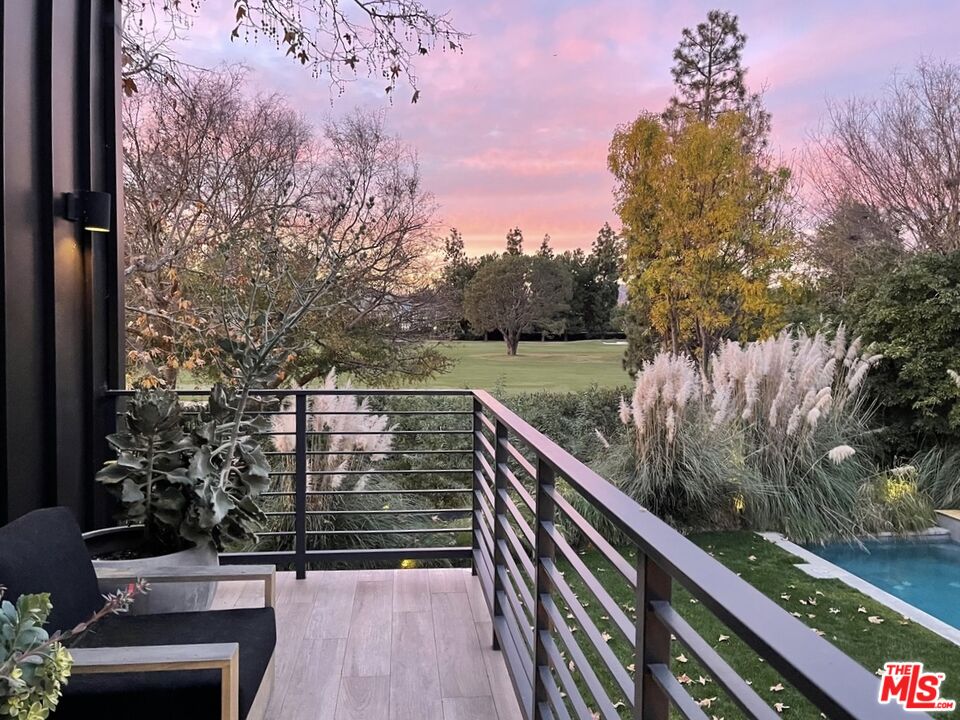226 South Rimpau Boulevard Los Angeles, CA 90004 - Photo 20 of 43 a view of a pathway with a wrought fence