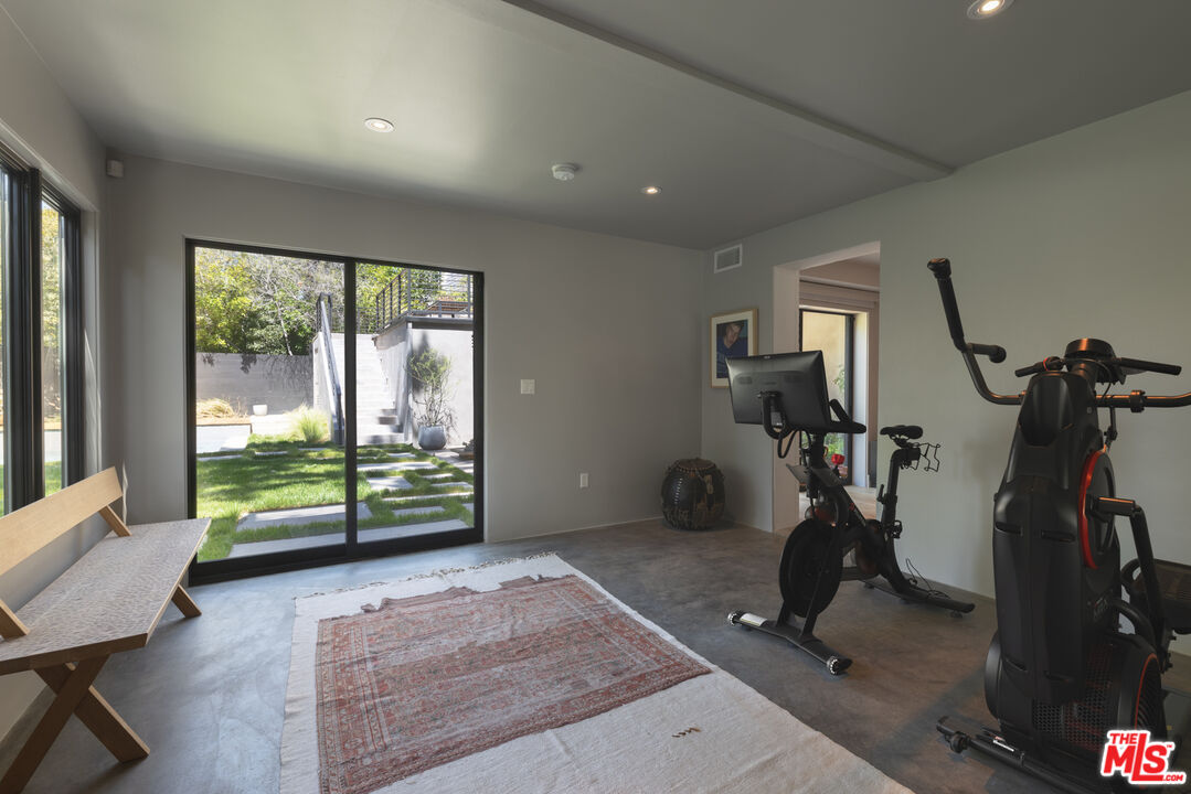 226 South Rimpau Boulevard Los Angeles, CA 90004 - Photo 28 of 43 a view of a room with gym equipment