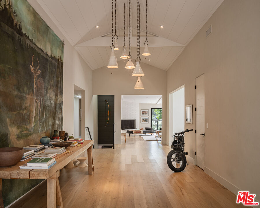 226 South Rimpau Boulevard Los Angeles, CA 90004 - Photo 3 of 43 a view of a livingroom with furniture and a chandelier