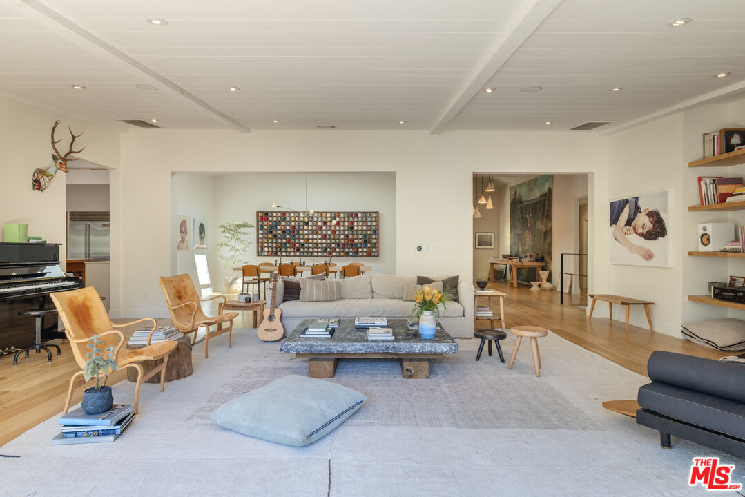 226 South Rimpau Boulevard Los Angeles, CA 90004 - Photo 8 of 43 a living room with furniture and a potted plant