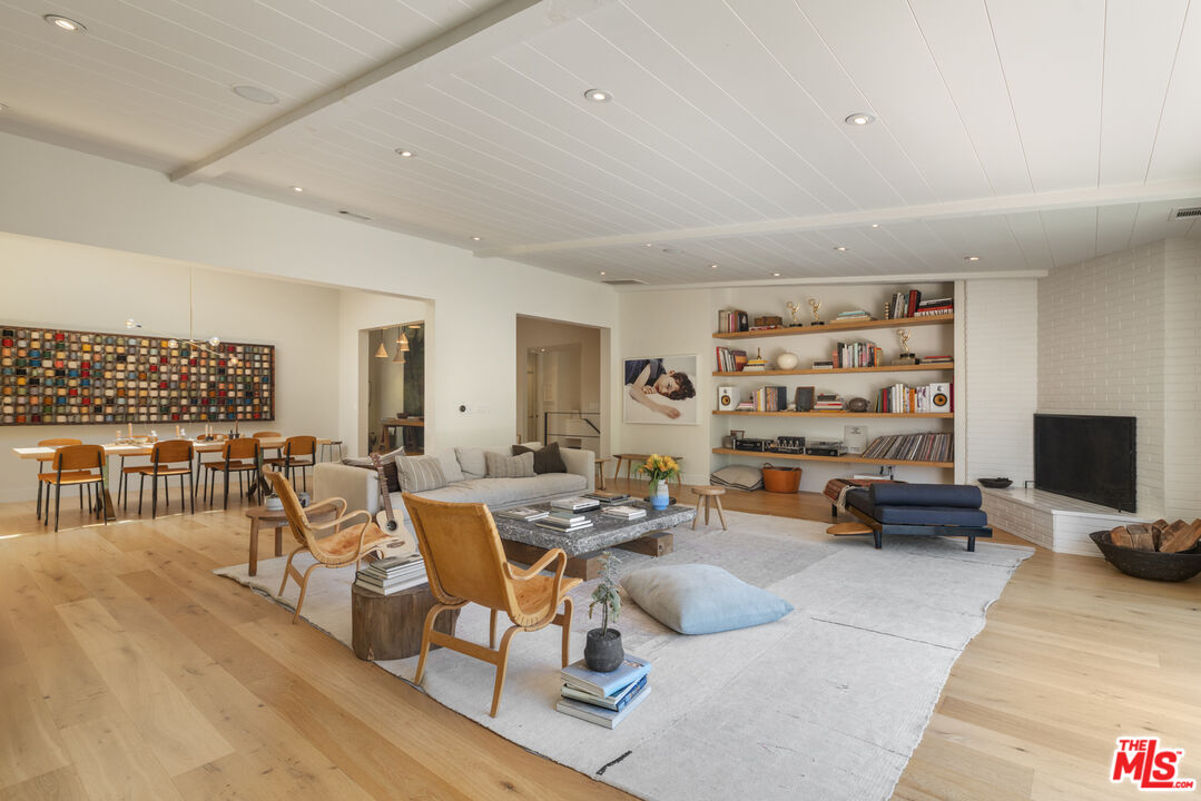226 South Rimpau Boulevard Los Angeles, CA 90004 - Photo 9 of 43 a living room with furniture and a flat screen tv