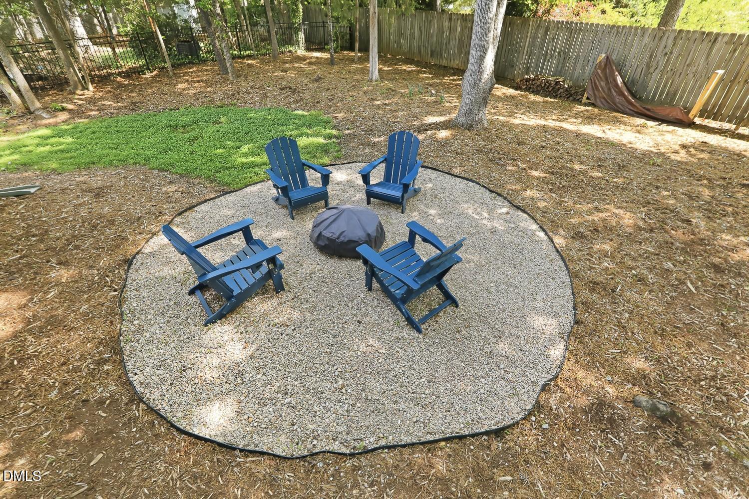 4001 Batiste Road Raleigh, NC 27613 - Photo 49 of 63 a view of a backyard with table and chairs