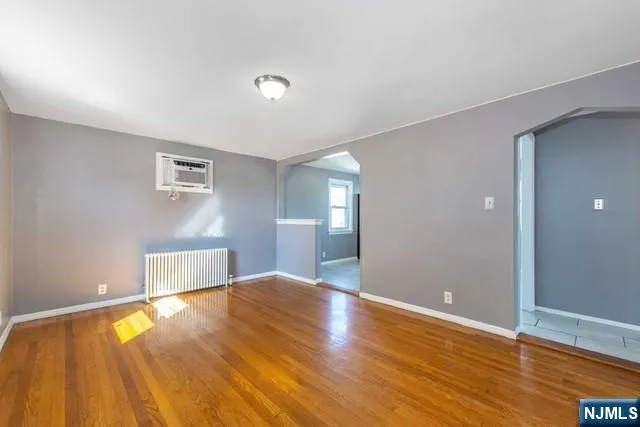 a view of a livingroom with wooden floor