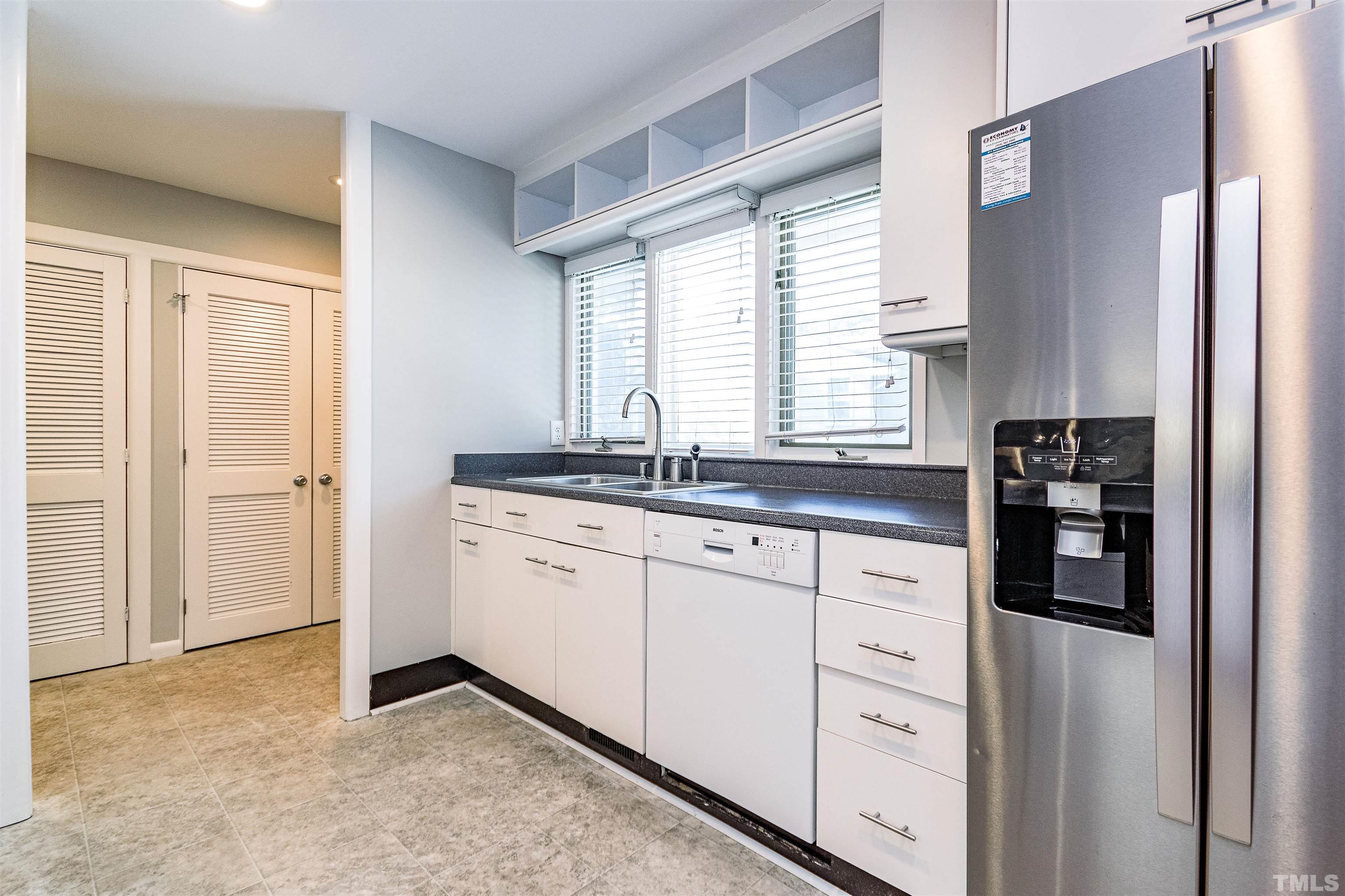 3412 Bradley Place Raleigh, NC 27607 - Photo 12 of 28 a kitchen with granite countertop cabinets appliances and a sink