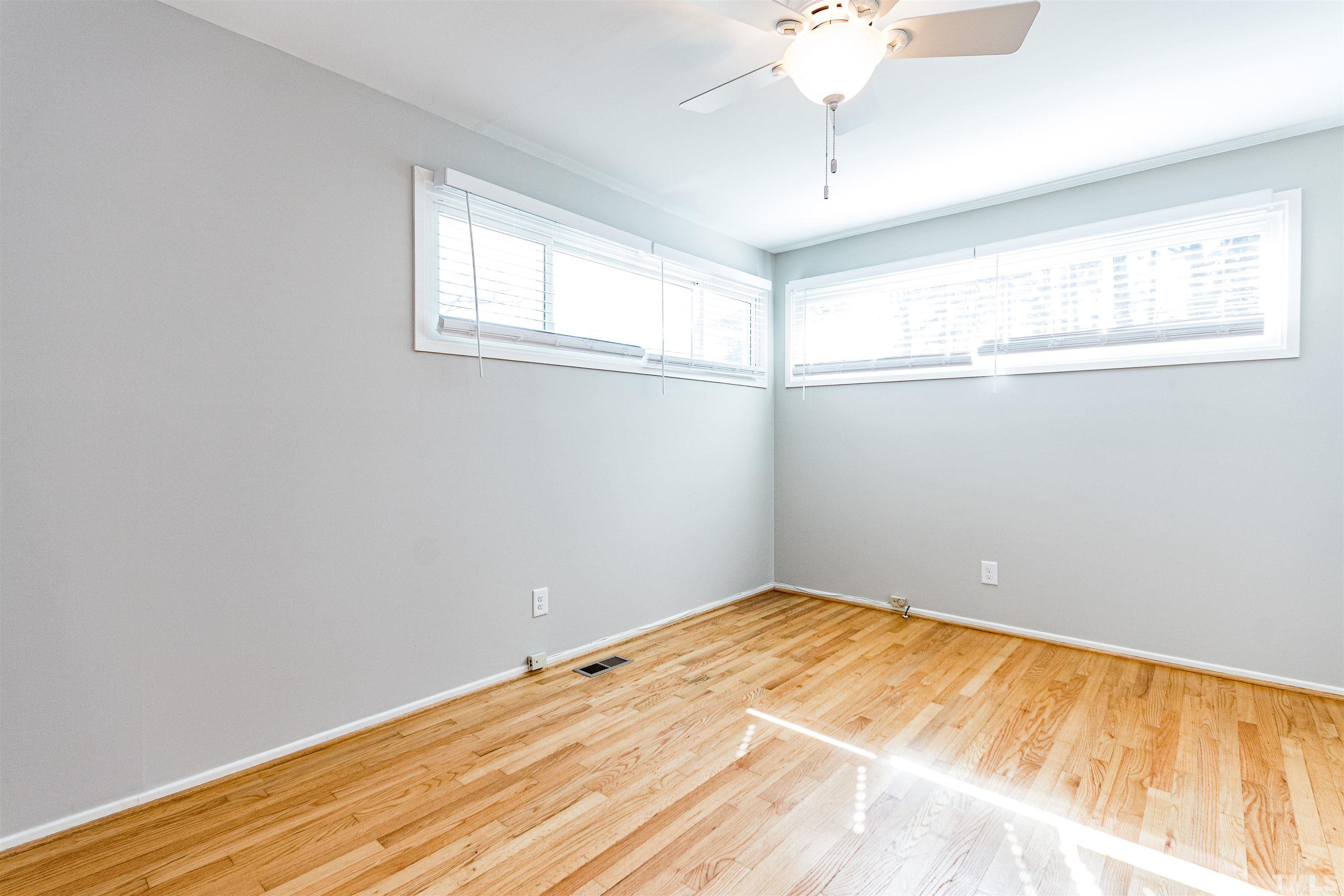 3412 Bradley Place Raleigh, NC 27607 - Photo 20 of 28 a view of empty room with wooden floor
