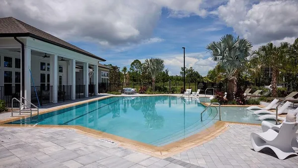a view of a swimming pool with a lounge chair