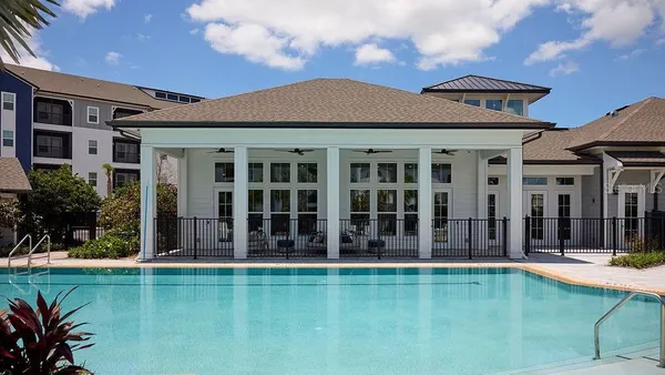 front view of a house with a swimming pool