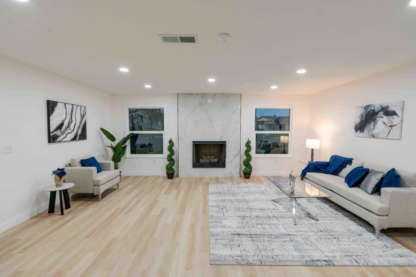 1429 Chadwick Place Manteca, CA 95336 - Photo 11 of 26 a living room with furniture and a fireplace
