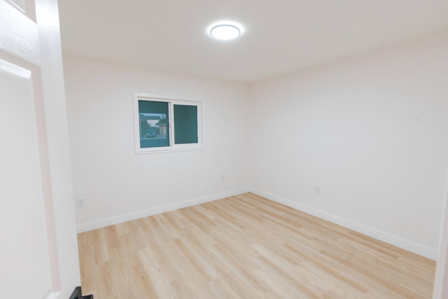 1429 Chadwick Place Manteca, CA 95336 - Photo 17 of 26 an empty room with a window