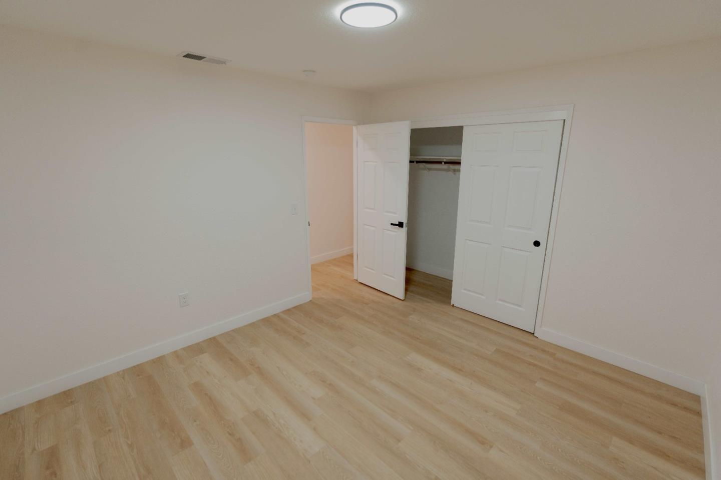 1429 Chadwick Place Manteca, CA 95336 - Photo 18 of 26 a view of an empty room with wooden floor