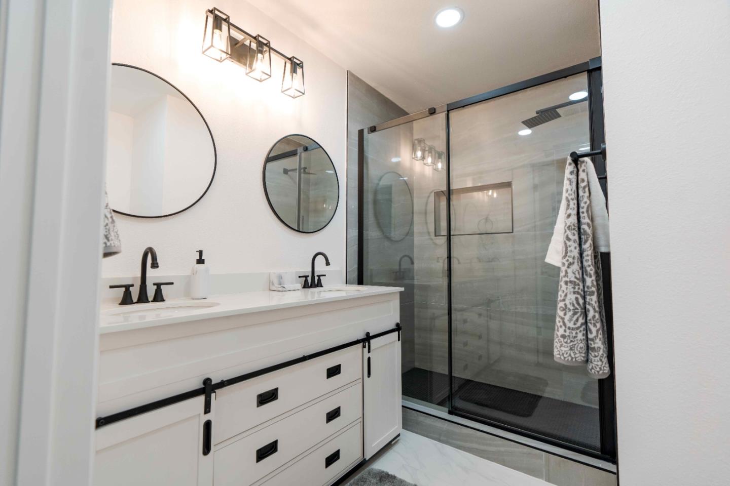 1429 Chadwick Place Manteca, CA 95336 - Photo 20 of 26 a bathroom with a sink and a mirror