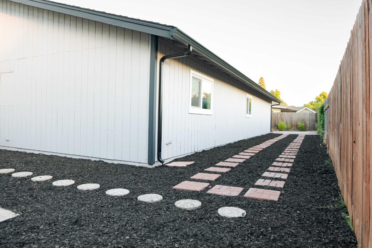 1429 Chadwick Place Manteca, CA 95336 - Photo 25 of 26 a backyard of a house with wooden floor