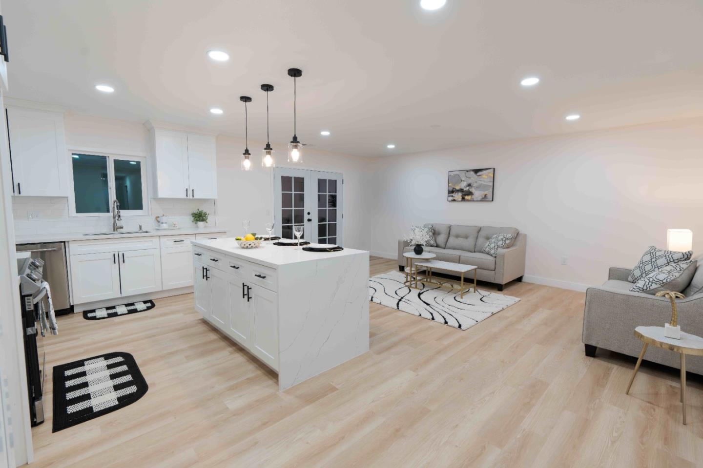 1429 Chadwick Place Manteca, CA 95336 - Photo 3 of 26 a living room with furniture and a chandelier