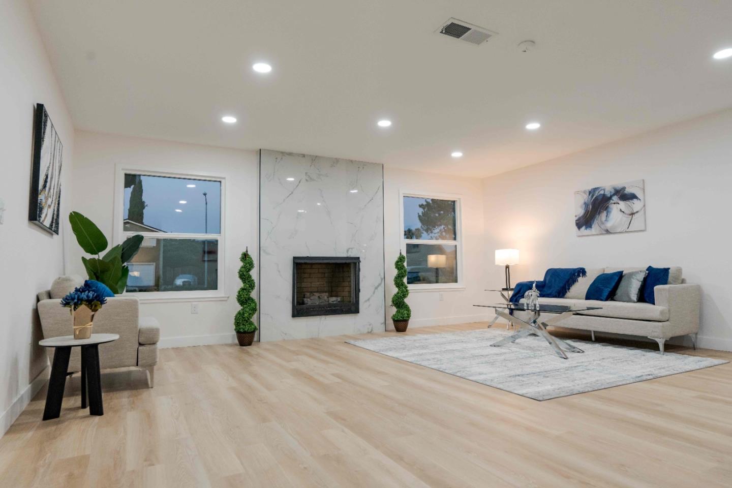 1429 Chadwick Place Manteca, CA 95336 - Photo 10 of 26 a living room with furniture and a fireplace