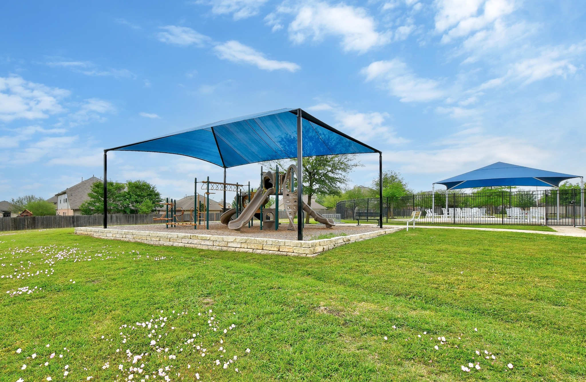 877 Hot Spring Valley Buda, TX 78610 - Photo 31 of 36 a view of a table and chairs under an umbrella