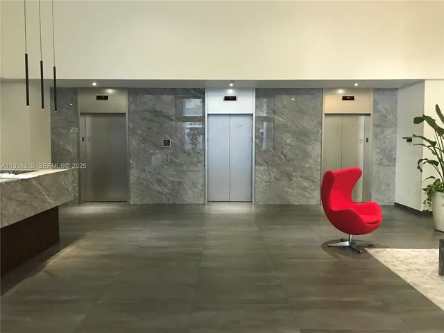 a view of an empty room and wooden floor