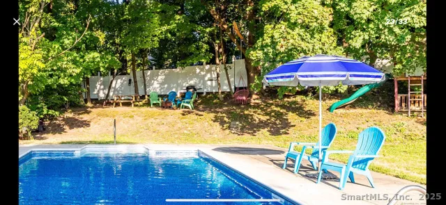 a view of swimming pool with a patio