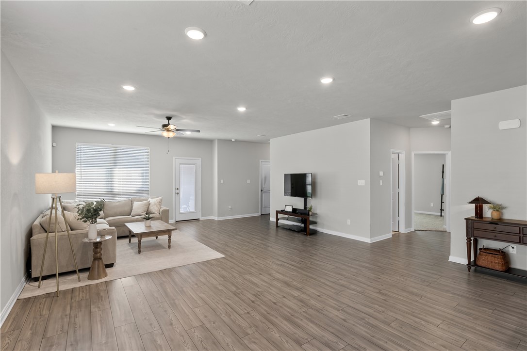 1925 Viva Road Bryan, TX 77807 - Photo 6 of 25 Living area with recessed lighting, light wood-type flooring, and ceiling fan