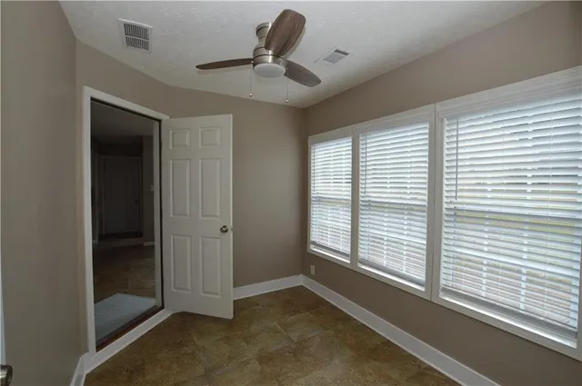 a room with window and wooden floor