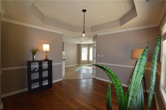 wooden floor in an empty room with a fireplace