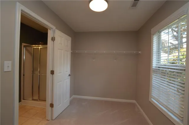 a view of an empty room with a window