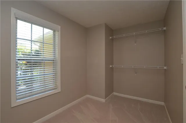 a view of a chair and table in the backyard