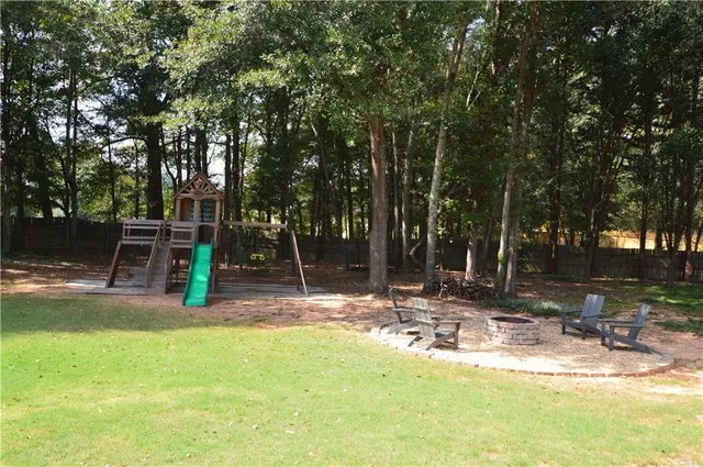 an aerial view of a house with outdoor space