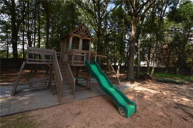 an aerial view of a house with outdoor space