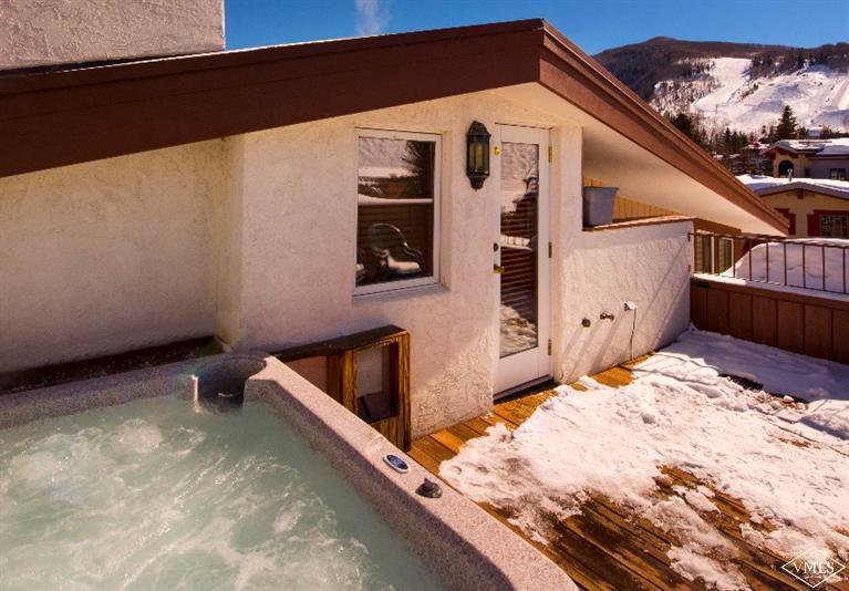 304 Bridge Street, Unit 3 Vail, CO 81657 - Photo 3 of 11 a view of backyard with a wooden fence