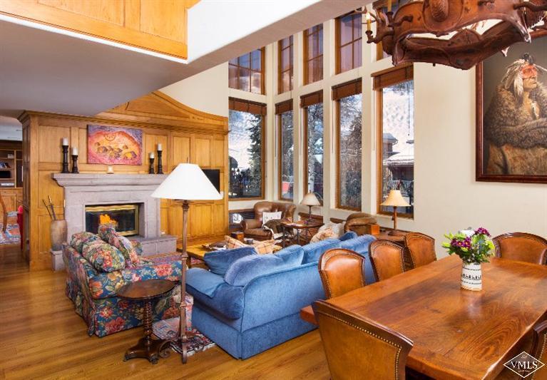 304 Bridge Street, Unit 3 Vail, CO 81657 - Photo 6 of 11 a living room with furniture a fireplace and a large window